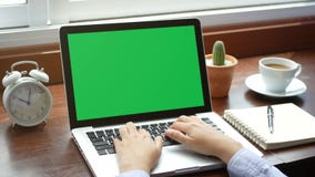 4K. close-up woman working with notebook laptop, using finger with keyboard for typing. computer laptop with blank green screen stock video footage 4K. close-up woman working with notebook laptop, using finger with keyboard for typing. computer laptop with blank green screen stock video footage