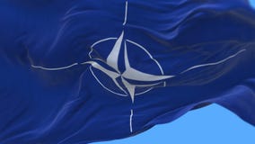 4k seamless Close up of nato flag slow waving in wind.alpha channel included.