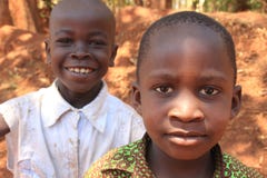Potraite of African village boy smiling and play near home in the Kampala suburb stock image Potraite of African village boy smiling and play near home in the Kampala suburb stock image