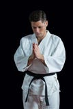 Karate gracz w modlitewnej pozie obrazy stock Karate gracz w modlitewnej pozie obrazy stock