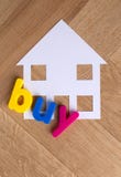 Kauf-Haushauptsymbol auf hölzernem Hintergrund stockfoto Kauf-Haushauptsymbol auf hölzernem Hintergrund stockfoto