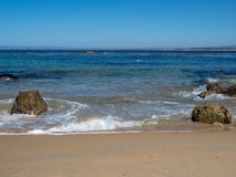 Kayakers in distance paddle in horizon from tropical beach waves royalty free stock photo Kayakers in distance paddle in horizon from tropical beach waves royalty free stock photo