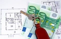 Key and money on home plan