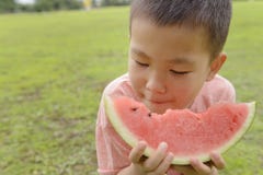 Kid eating watermelon Royalty Free Stock Images Kid eating watermelon Royalty Free Stock Images