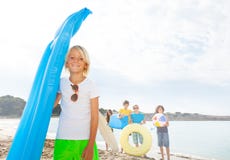Kid with friends on sandy beach Royalty Free Stock Images Kid with friends on sandy beach Royalty Free Stock Images