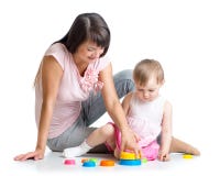 Kid girl and mother play together with cup toys royalty free stock photography Kid girl and mother play together with cup toys royalty free stock photography