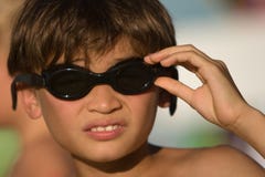 Kid with goggles ready to go for a swim stock photos Kid with goggles ready to go for a swim stock photos