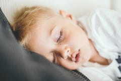 Kid sleeping on a sofa. royalty free stock images Kid sleeping on a sofa. royalty free stock images