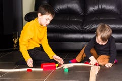 Kids boys playing with wooden trains royalty free stock images Kids boys playing with wooden trains royalty free stock images