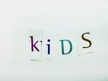 Kids - Cutout Words Collage Of Mixed Magazine Letters with White Background royalty free stock photo Kids - Cutout Words Collage Of Mixed Magazine Letters with White Background royalty free stock photo