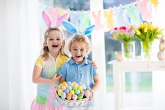 Kids with eggs basket on Easter egg hunt stock photos Kids with eggs basket on Easter egg hunt stock photos