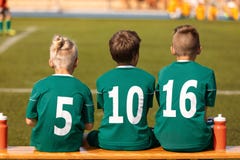 Kids Football Team. Soccer children watching game. Football soccer tournament match for children royalty free stock photography Kids Football Team. Soccer children watching game. Football soccer tournament match for children royalty free stock photography