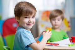 Kids with play clay at home stock photos Kids with play clay at home stock photos