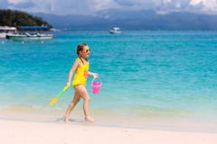 Kids play on tropical beach. Sand and water toy royalty free stock images Kids play on tropical beach. Sand and water toy royalty free stock images