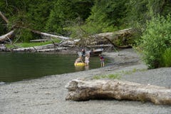 Kids Playing At Lake In Olympic National Park Stock Photography