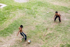 Kids are playing football Stock Image Kids are playing football Stock Image