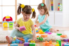 Kids Playing With Colorful Block Toys. Children Building Towers At Home Or Daycare Centre. Educational Child Toys For Preschool An Royalty Free Stock Image