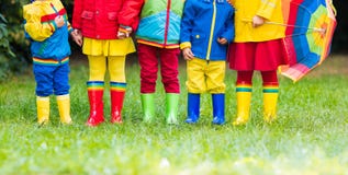 Kids in rain boots. Rubber boots for children. Royalty Free Stock Images Kids in rain boots. Rubber boots for children. Royalty Free Stock Images