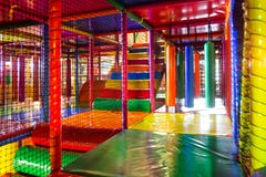 Kids running inside a Colorful indoor playground