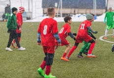 Kids soccer football tournament - children players match on socc royalty free stock image Kids soccer football tournament - children players match on socc royalty free stock image