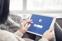 Woman using Facebook app on a brand new Apple iPad Pro royalty free stock photo Woman using Facebook app on a brand new Apple iPad Pro royalty free stock photo