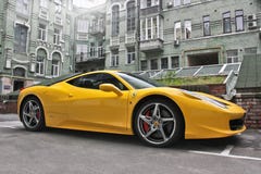 Kiev, Ukraine. August 28, 2017. Ferrari 458 Italia. Yellow supercar on the background of houses stock image Kiev, Ukraine. August 28, 2017. Ferrari 458 Italia. Yellow supercar on the background of houses stock image