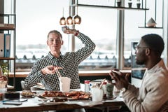 Kind blonde male throwing paper ball forward royalty free stock photo Kind blonde male throwing paper ball forward royalty free stock photo