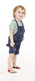 Kind mit den gemalten Füßen Hose halten lizenzfreies stockfoto Kind mit den gemalten Füßen Hose halten lizenzfreies stockfoto