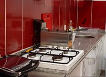 Kitchen and cooking utensils in the restaurant - fryer, stove, s royalty free stock photo Kitchen and cooking utensils in the restaurant - fryer, stove, s royalty free stock photo