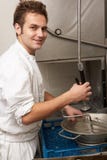 Kitchen Worker Washing Up In Restaurant Kitchen royalty free stock photography Kitchen Worker Washing Up In Restaurant Kitchen royalty free stock photography