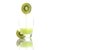 Kiwi juice poured into the glass isolated on white