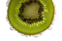 Kiwi Slice With Bubbles Royalty Free Stock Images