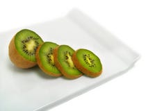 Kiwi Slices On Cutting Board Royalty Free Stock Images