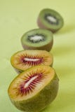 Kiwifruits on green background stock photos Kiwifruits on green background stock photos