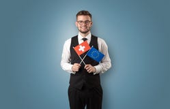 Knappe student die zich met nationale vlag bevinden stock afbeeldingen Knappe student die zich met nationale vlag bevinden stock afbeeldingen