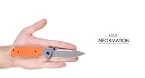 Knife folding with orange handle in hand pattern stock image Knife folding with orange handle in hand pattern stock image