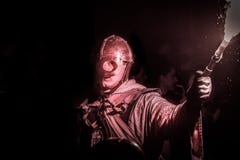 Knight in armour with a torch in the hand stock images Knight in armour with a torch in the hand stock images