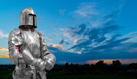 Knight in helmet and metal armor