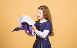 Knowledge and education. Back to school. serious small girl wants to be teacher. notebook for diary notes. study lesson stock photography Knowledge and education. Back to school. serious small girl wants to be teacher. notebook for diary notes. study lesson stock photography