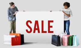 Kobieta z torba na zakupy i sprzedaży deska fotografia stock Kobieta z torba na zakupy i sprzedaży deska fotografia stock