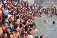Kolkata, India - October 12: Hindu people take a bath in the ri.