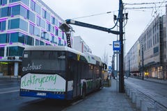 KRAKOW, POLAND, January 28, 2017 electric bus is charging at a b stock photos KRAKOW, POLAND, January 28, 2017 electric bus is charging at a b stock photos