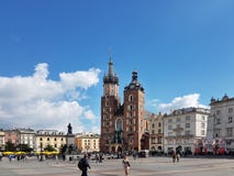 Krakow, Poland - 09.13.2017: Morning town after the rain. The central city square with the Mariacki temple. stock photos Krakow, Poland - 09.13.2017: Morning town after the rain. The central city square with the Mariacki temple. stock photos