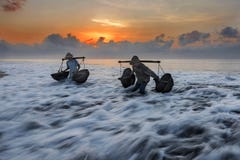 Kusamba salt farmer collecting sea water Bali stock photos Kusamba salt farmer collecting sea water Bali stock photos