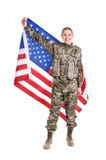 Kvinnlig soldat med amerikanska flaggan royaltyfri bild Kvinnlig soldat med amerikanska flaggan royaltyfri bild