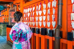 Asian women wearing japanese traditional kimono visiting the beautiful in Fushimi Inari Shrine in Kyoto, Japan royalty free stock photos Asian women wearing japanese traditional kimono visiting the beautiful in Fushimi Inari Shrine in Kyoto, Japan royalty free stock photos