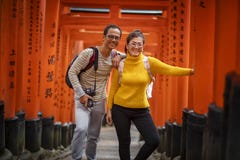 Kyoto Japan - November9,2018 : Couples Asian Tourist Taking A Photo In Red Wood Pole Of Fushimi Inari Shrine Fushimi Inari Is One Stock Photos