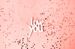 L'amore di parola voi su un fondo di corallo con molti cuori fotografia stock L'amore di parola voi su un fondo di corallo con molti cuori fotografia stock