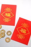 L'enveloppe d'Ed a appelé des pièces d'or d'Ang Pao et dans le concept chinois de nouvelle année images stock L'enveloppe d'Ed a appelé des pièces d'or d'Ang Pao et dans le concept chinois de nouvelle année images stock