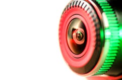 L'obiettivo con luce colorata, immagine isolata sulle sedere bianche fotografia stock libera da diritti L'obiettivo con luce colorata, immagine isolata sulle sedere bianche fotografia stock libera da diritti